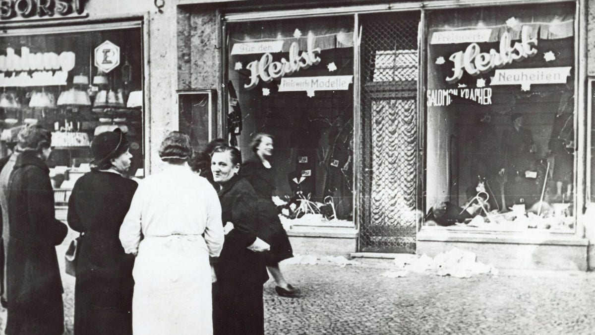 People stand outside a shop
