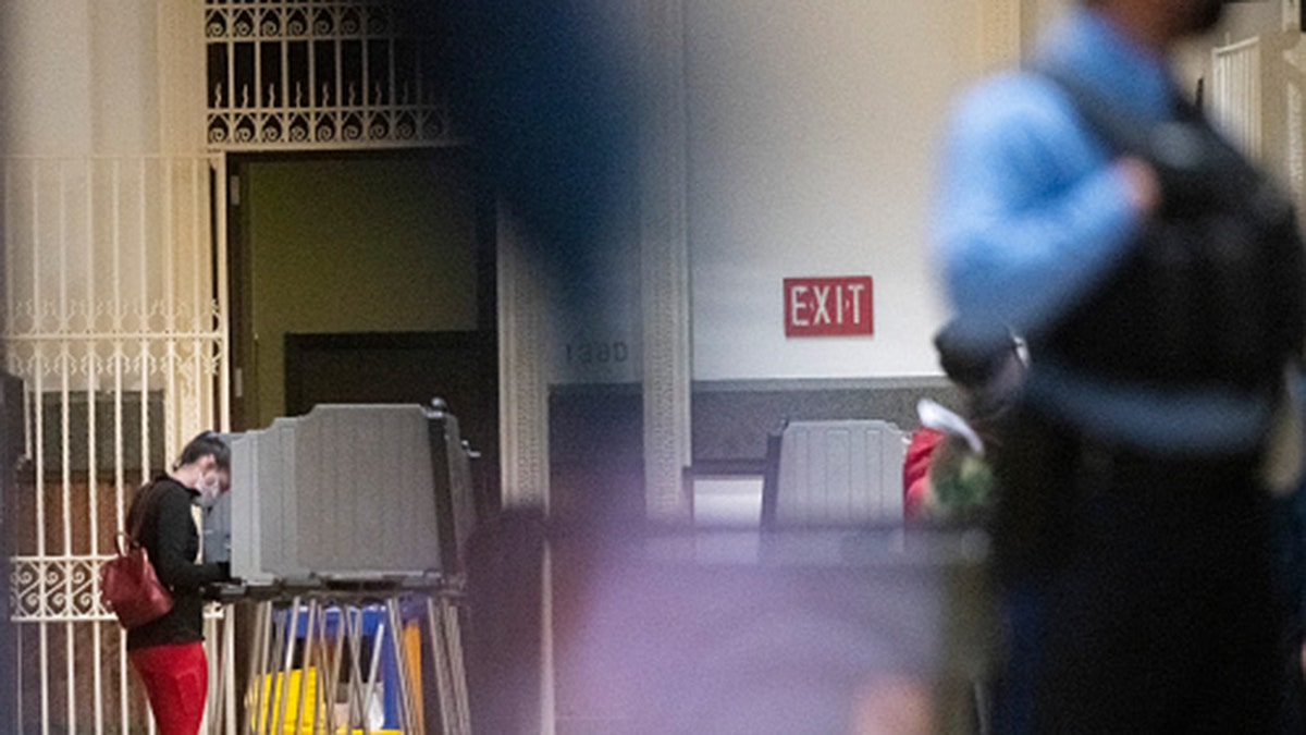 A woman casts her ballot at Philadelphia City Hall on the final day to vote early at a satellite polling station on October 27, 2020, in Philadelphia, Pennsylvania. (Mark Makela/Getty Images)