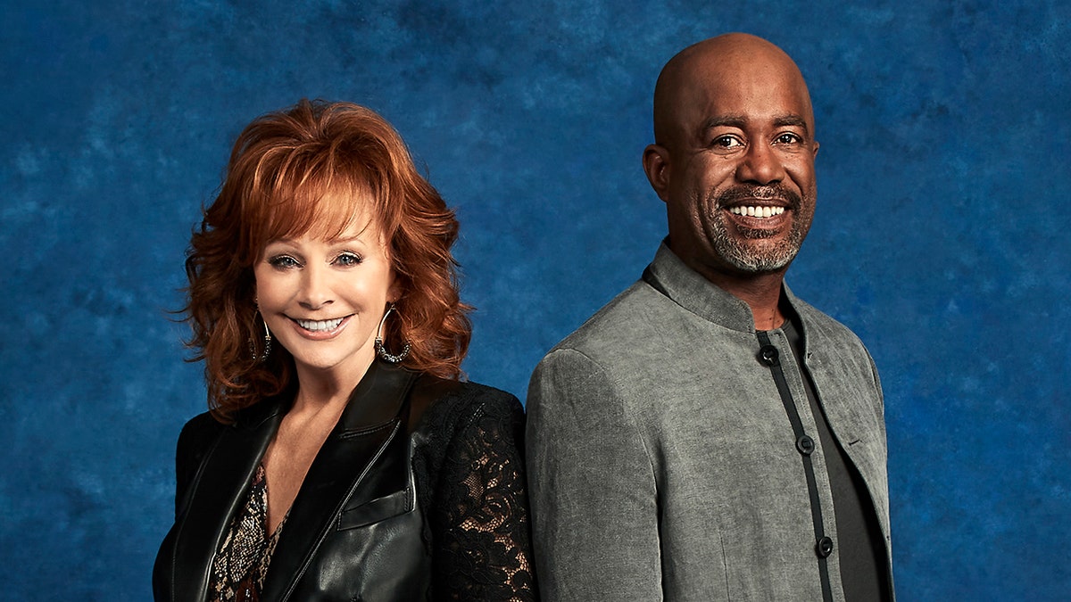 Reba McEntire and Darius Rucker are hosting the 2020 CMAs. They focused on unity and music, and not on politics during their intro. (Alysse Gafkjen via Getty Images)