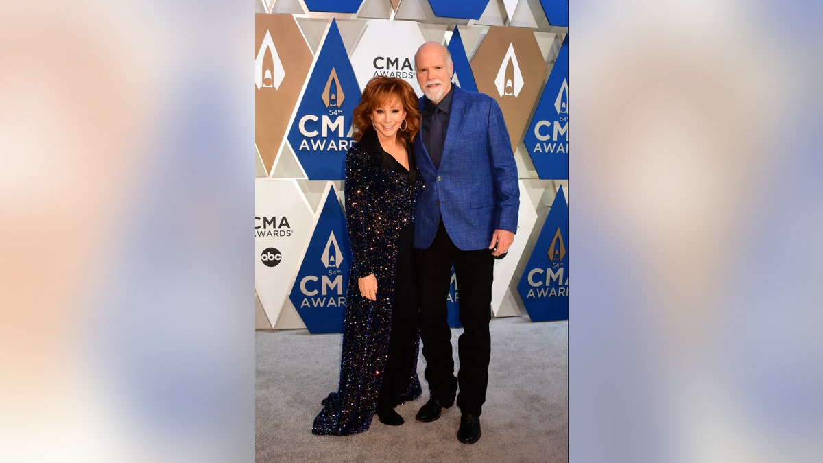 Reba McEntire and boyfriend Rex Linn made their red carpet debut at the CMA Awards. Linn got a special shout-out during McEntire's intro. (ABC via Getty Images)