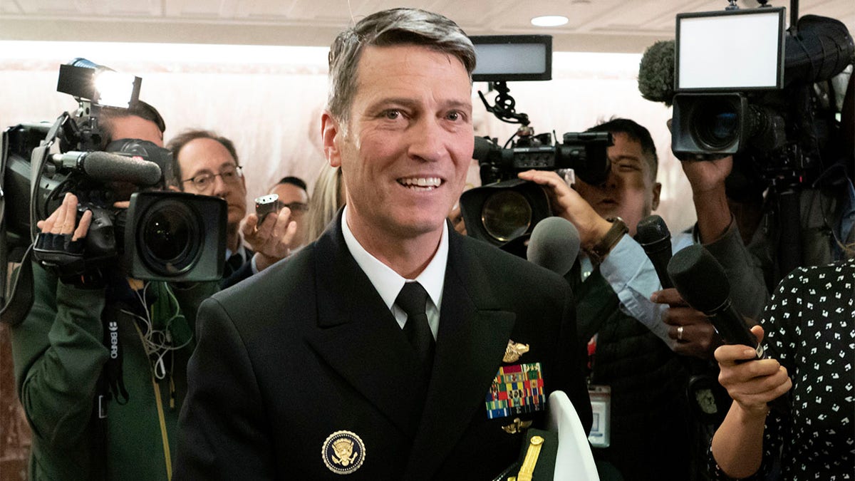 FILE - In this April 24, 2018 file photo, Ronny Jackson leaves a Senate office building on Capitol Hill in Washington. Jackson, President Donald Trump's former White House physician and onetime pick to head the Department of Veterans Affairs, is running for a congressional seat out of Texas. (AP Photo/J. Scott Applewhite, File)