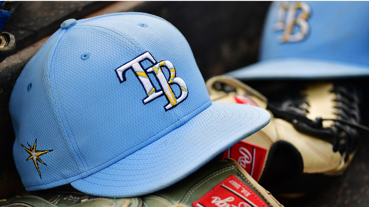 A Tampa Bay Rays hat sits on top of a glove in the dugout during a Grapefruit League spring training game between the Baltimore Orioles and the Tampa Bay Rays at Ed Smith Stadium on March 2, 2020, in Sarasota, Florida. (Getty Images)
