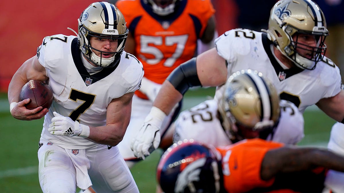 New Orleans Saints quarterback Taysom Hill (7) runs in for a touchdown during the first half of an NFL football game against the Denver Broncos, Sunday, Nov. 29, 2020, in Denver. (AP Photo/David Zalubowski)