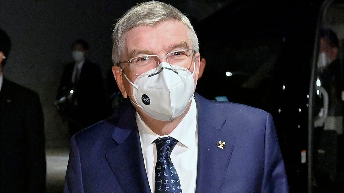 International Olympic Committee President Thomas Bach arrives at a hotel in Tokyo Sunday, Nov. 15, 2020. IOC President Bach is beginning a visit to Tokyo to convince politicians and the Japanese public that the postponed Olympics will open in just over eight months.(Kyodo News via AP)