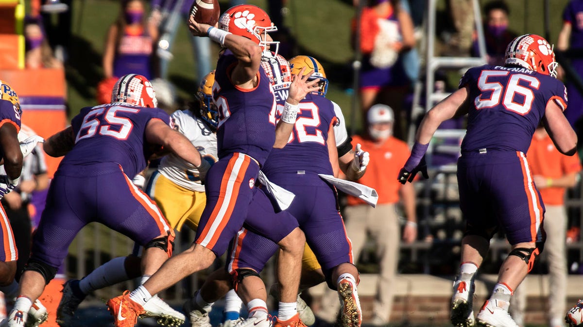 Clemson quarterback Trevor Lawrence (16) makes a pass during the first half of an NCAA college football game against Pittsburgh Saturday, Nov. 28, 2020, in Clemson, S.C. (Ken Ruinard/Pool Photo via AP)