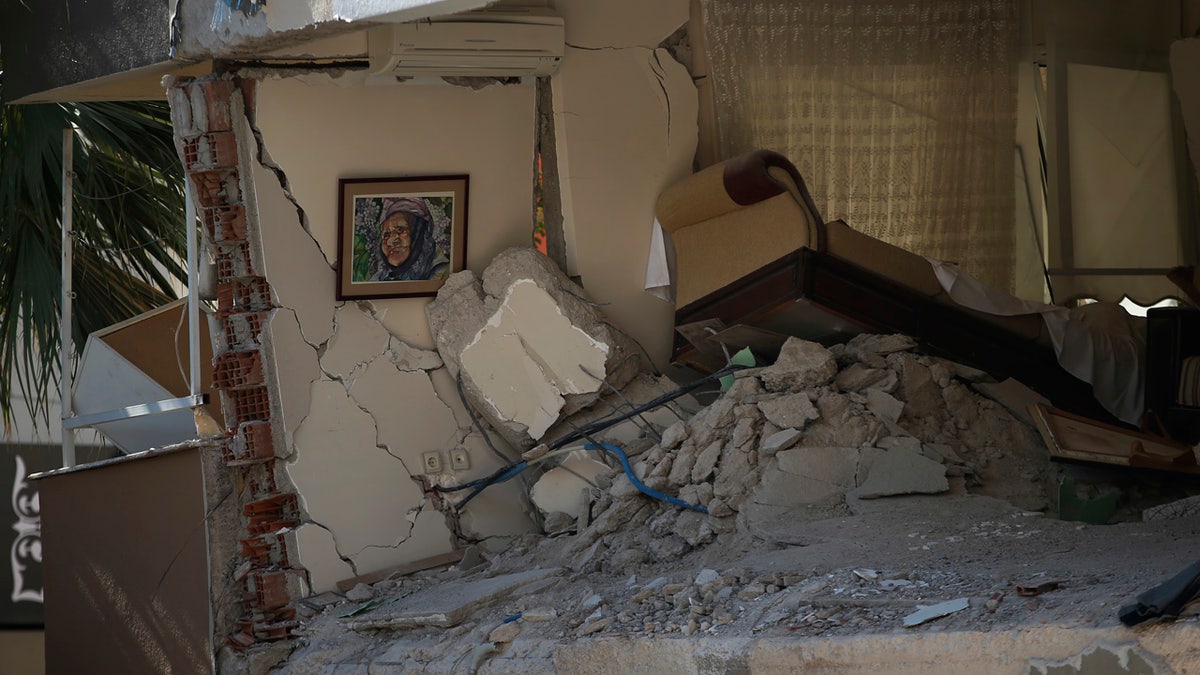 The interior of a destroyed living room of a family flat is seen after the building collapsed in Izmir, Turkey, Sunday, Nov. 1, 2020.