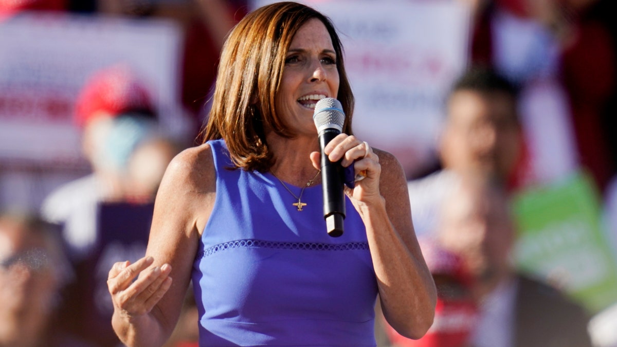 Sen. Martha McSally, R-Ariz., speaks on stage as a campaign rally