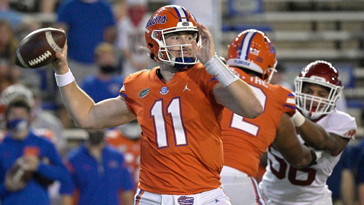 Florida quarterback Kyle Trask (11) looks to throw a pass during the first half of an NCAA college football game against Arkansas, Saturday, Nov. 14, 2020, in Gainesville, Fla. (AP Photo/Phelan M. Ebenhack)