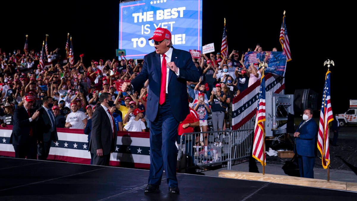 President Donald Trump dances as he walks off stage after speaking during a campaign rally at Miami-Opa-locka Executive Airport, Monday, Nov. 2, 2020, in Opa-locka, Fla. (AP Photo/Evan Vucci)