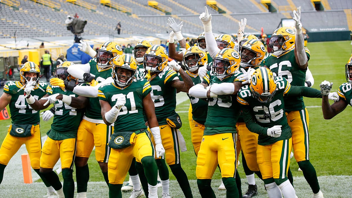 The Green Bay Packers defense celebrates after an interception and touchdown return during the first half of an NFL football game against the Jacksonville Jaguars Sunday, Nov. 15, 2020, in Green Bay, Wis. (AP Photo/Matt Ludtke)