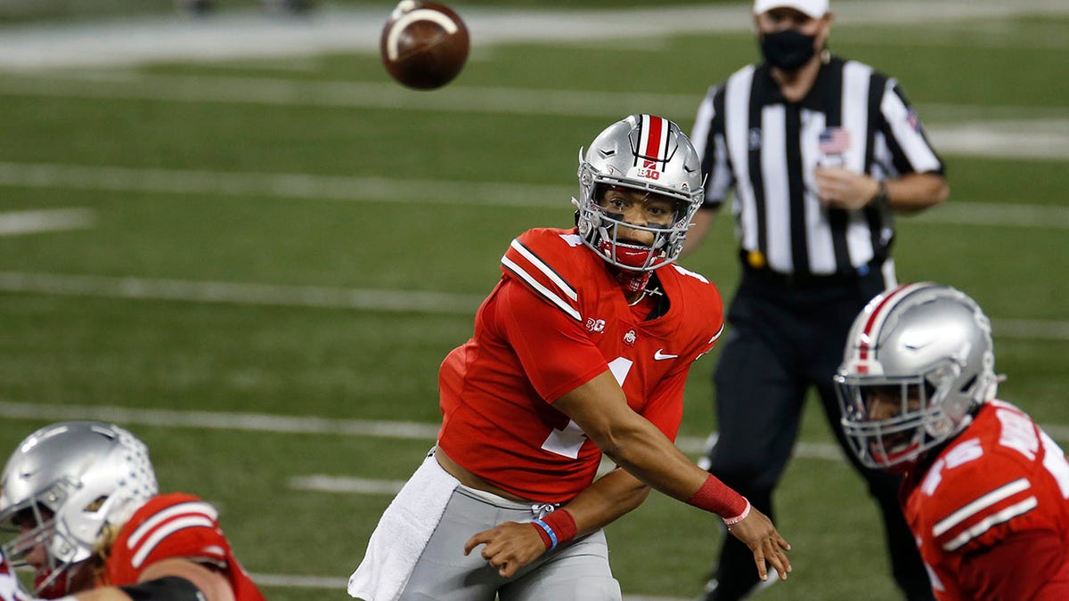 Ohio State quarterback Justin Fields throws a pass against Rutgers during the first half of an NCAA college football game Saturday, Nov. 7, 2020, in Columbus, Ohio. (AP Photo/Jay LaPrete)