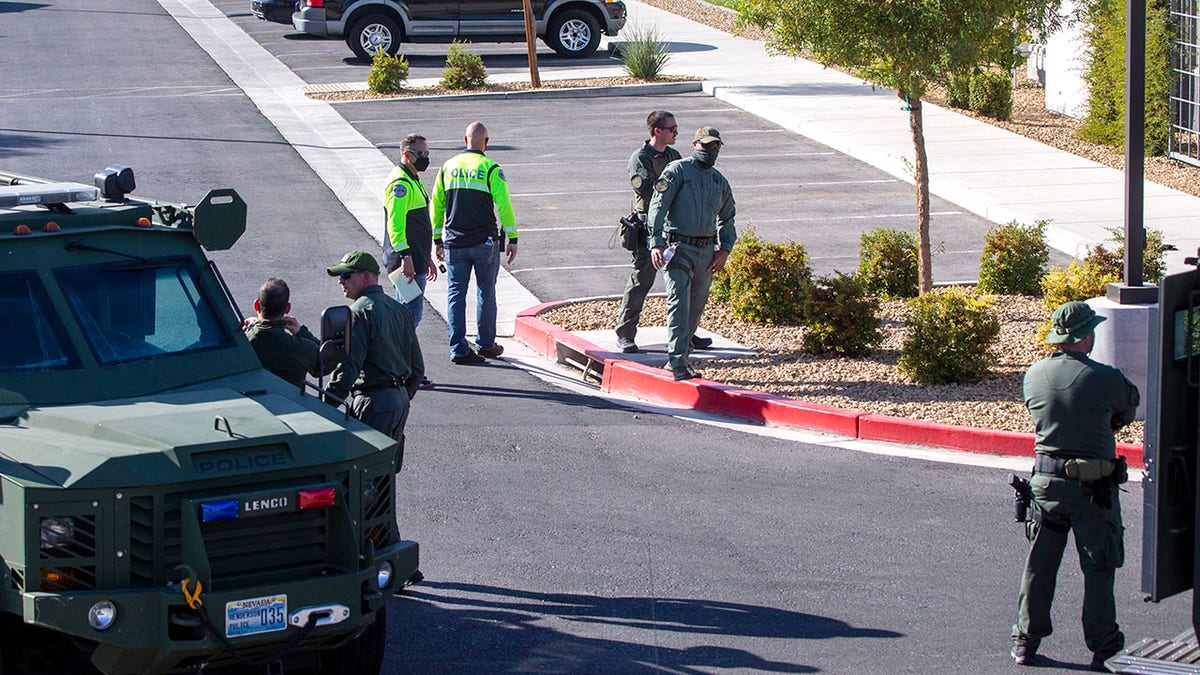 Henderson Police officers are shown at the scene of a fatal shooting in an apartment complex in Henderson, Nevada. (Steve Marcus/Las Vegas Sun via AP)