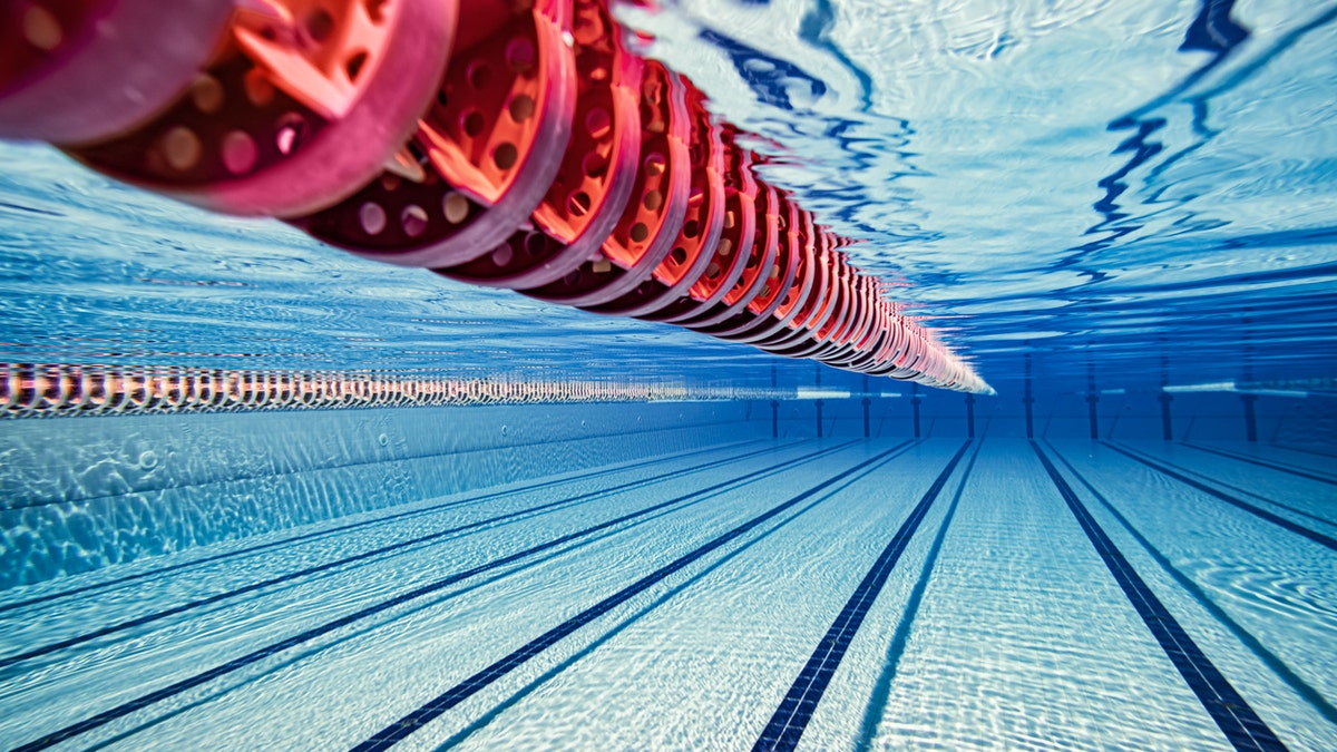 Olympic Swimming pool underwater background.