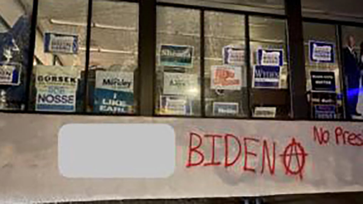 A group spray-painted an anarchy symbol and messages like "F--- Biden" and "no presidents" on the Multnomah County Democrats campaign office in Portland Sunday. (Portland Police Bureau)
