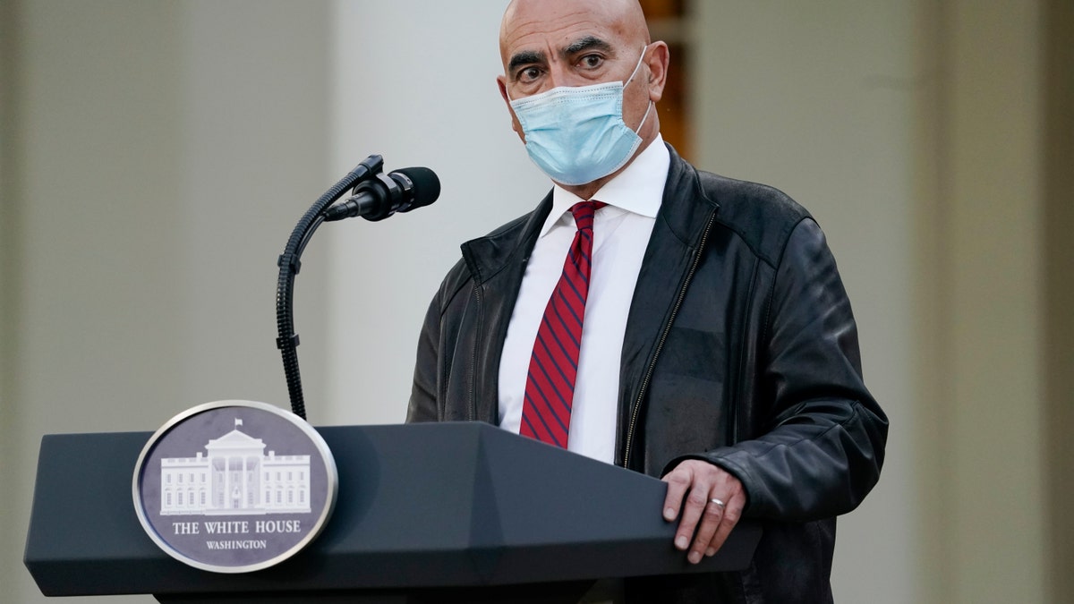 Dr. Moncef Slaoui, chief adviser to Operation Warp Speed, speaks in the Rose Garden of the White House, Friday, Nov. 13, 2020, in Washington. (AP Photo/Evan Vucci)