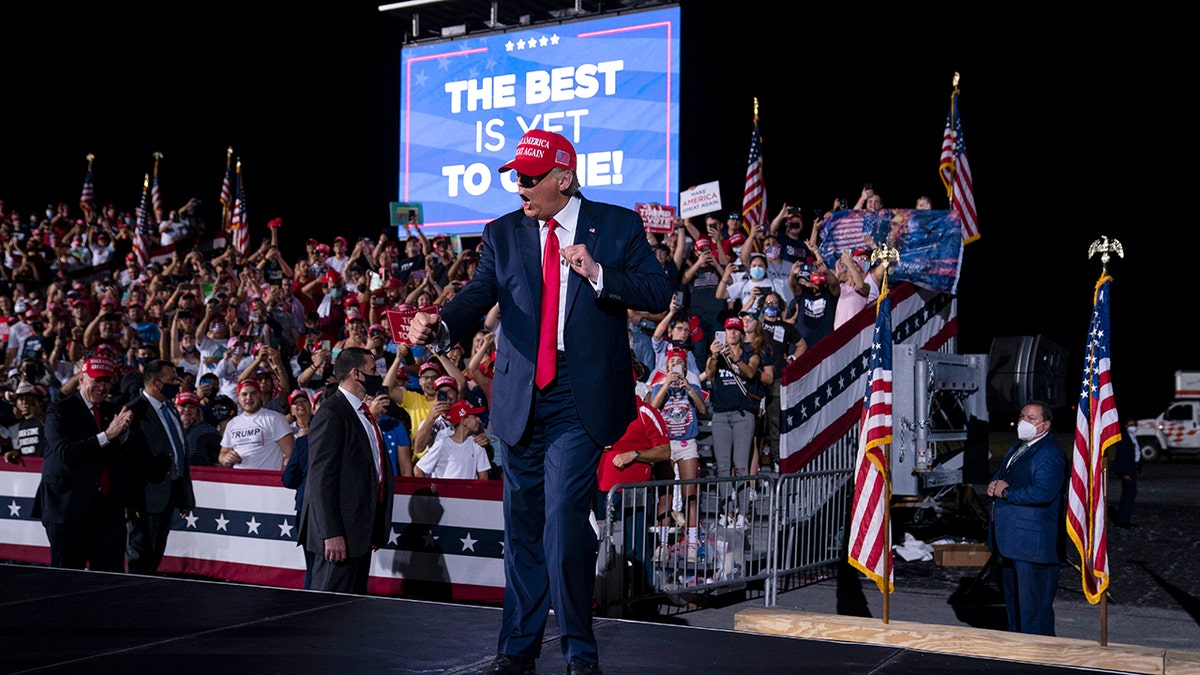 President Trump dances as he walks off stage after speaking during a campaign rally at Miami-Opa-locka Executive Airport, Monday, Nov. 2, 2020, in Opa-locka, Fla.