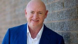 Democratic challenger Mark Kelly, for the U.S. Senate race against Republican incumbent Martha McSally, poses for a photo outside of the Udall Park Main Recreation Center, Tuesday, Sept. 29, 2020. (Mamta Popat/Arizona Daily Star via AP)
