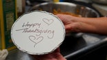 Volunteers prepare individual Thanksgiving meals for seniors in Hawthorne, N.J., on Nov. 3, 2020. With a fall surge of coronavirus infections gripping the U.S., many Americans are forgoing tradition and getting creative with celebrations. (AP Photo/Kathy Young)