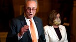 FILE - In this Aug. 6, 2020, file photo Senate Minority Leader Sen. Chuck Schumer of N.Y., speaks to reporters as House Speaker Nancy Pelosi of Calif., listens at right on Capitol Hill in Washington. On Tuesday, Nov. 10, Schumer, won his party's support to stay on leading the Democrats in the Senate, according to a Democrat granted anonymity to discuss the closed-door balloting. (AP Photo/Carolyn Kaster, File)