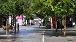 A lone man walks in a nearly empty pedestrian mall in Adelaide, Australia, Thursday, Nov. 19, 2020. South Australia state that includes the city of Adelaide is in a six-day lockdown schools, universities, bars and cafes closed from Thursday and only one person from each household will be allowed to leave home each day, and only for specific reasons. (David Mariuz/AAP Image via AP)