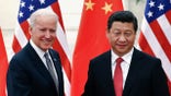 Chinese President Xi Jinping shakes hands with U.S. Vice President Joe Biden (L) inside the Great Hall of the People in Beijing December 4, 2013. REUTERS/Lintao Zhang/Pool (CHINA - Tags: POLITICS) - GM1E9C41JRZ01