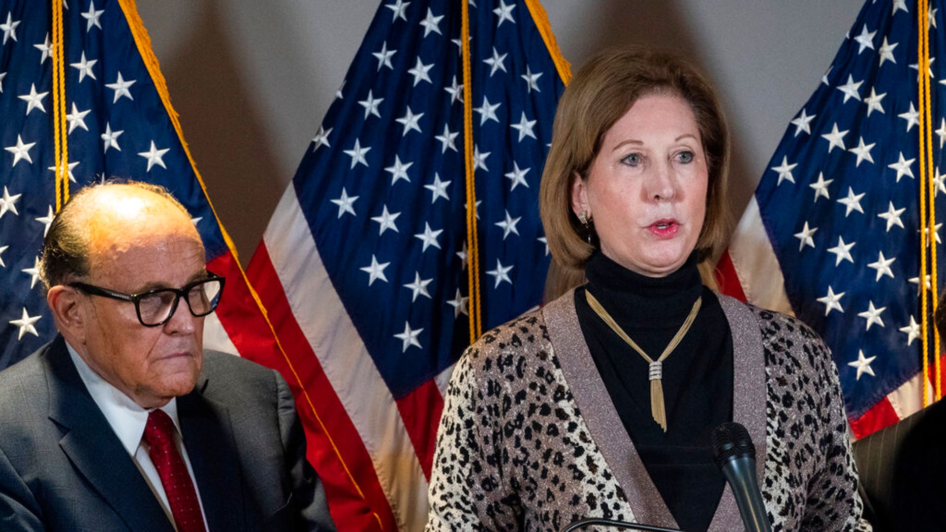 Sidney Powell and Rudy Giuliani at a press conference