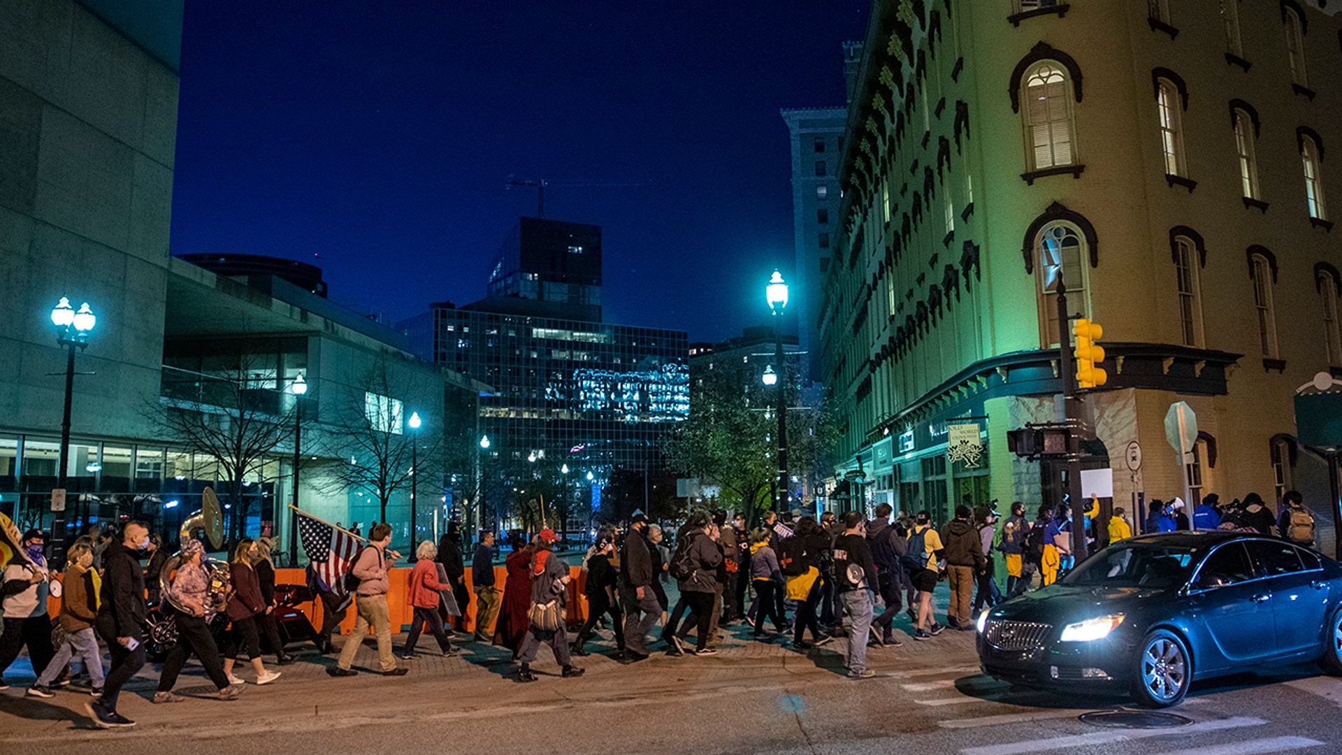 A crowd takes part in a Count Every Vote rally in downtown Grand Rapids, Mich., Wednesday, Nov. 4, 2020.