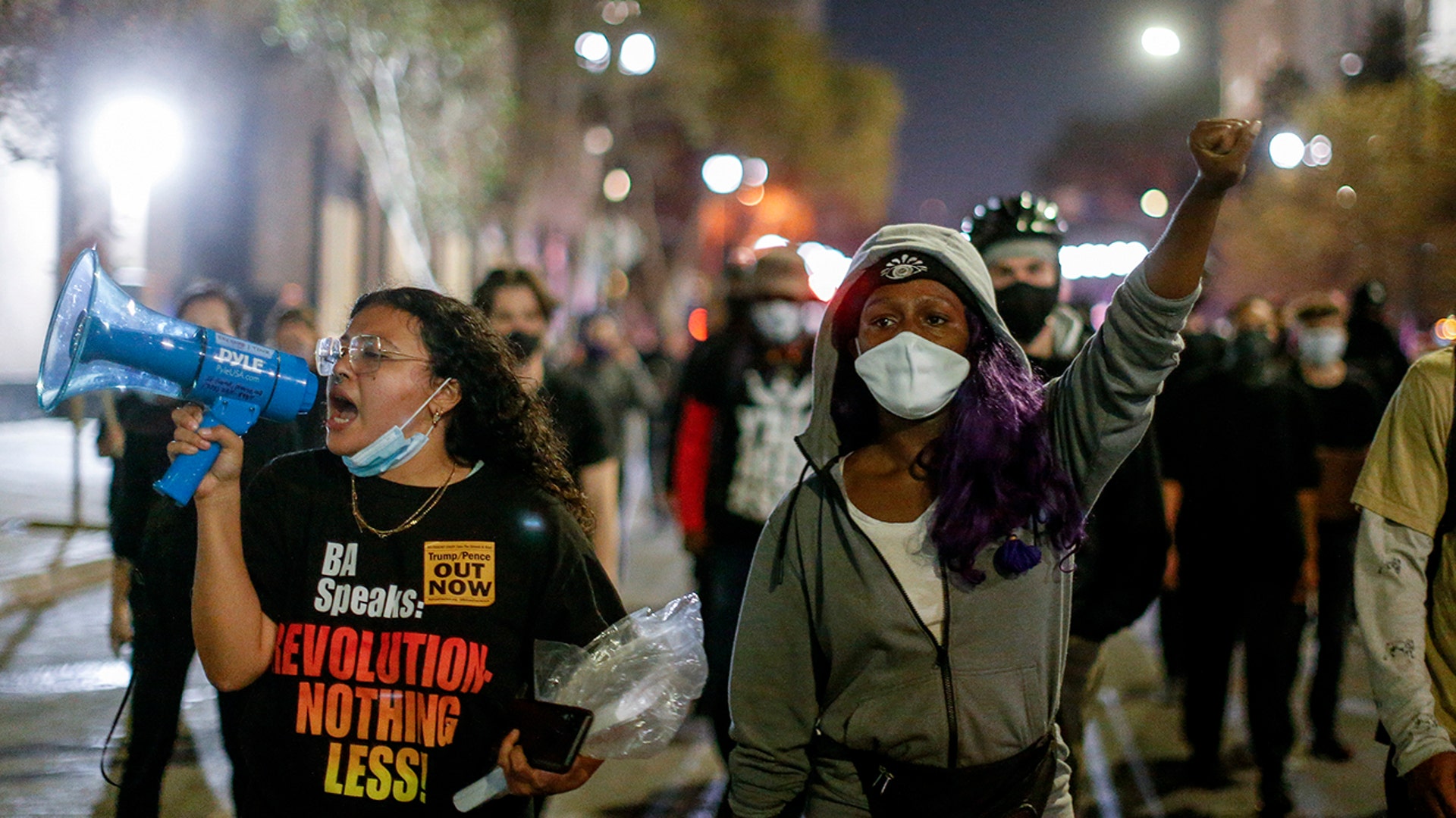 Protesters march in Los Angeles, Wednesday, Nov. 4, 2020, following Tuesday's elections.