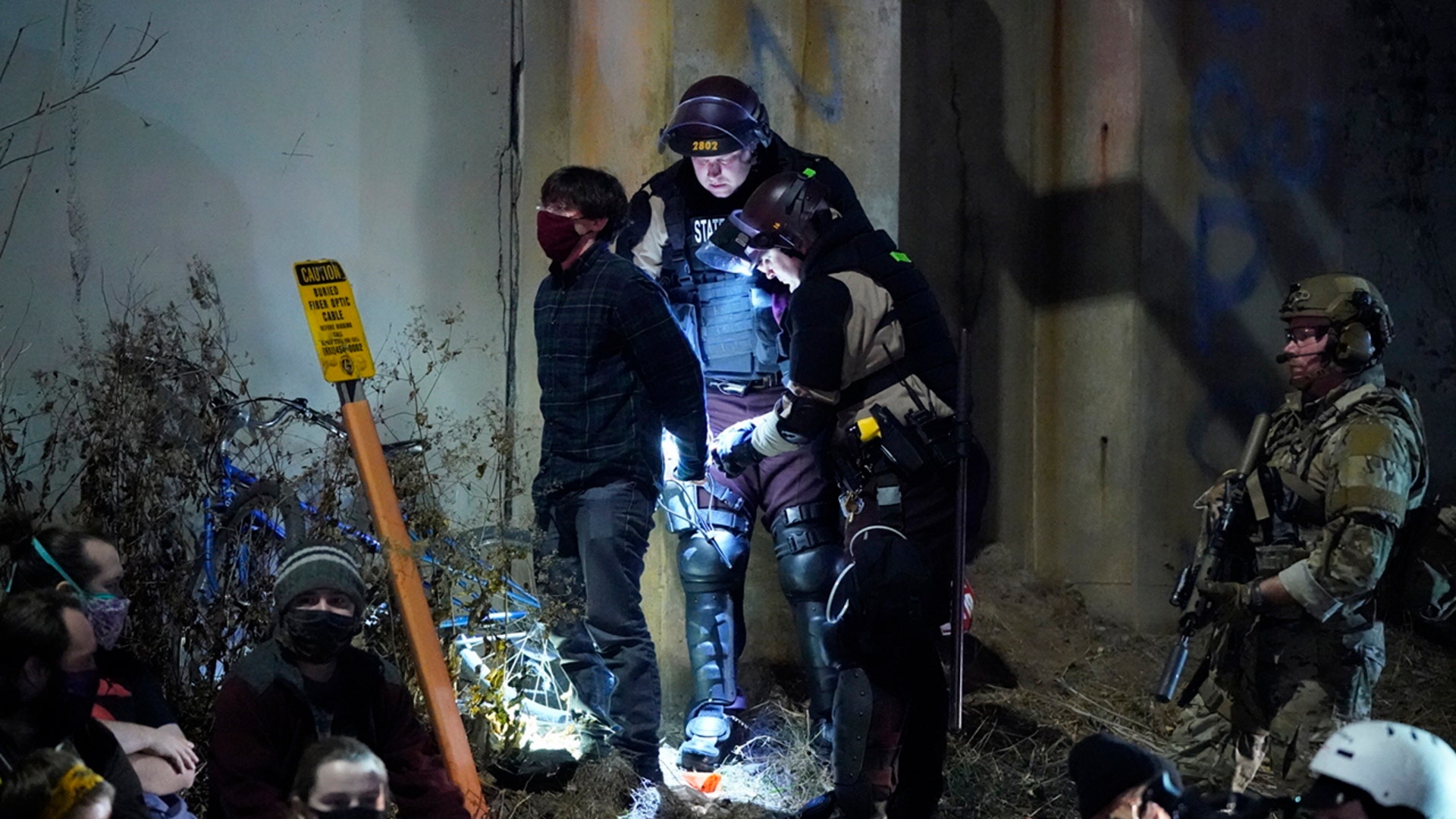 Minneapolis and State Patrol police arrest people on I-94 during the National Day of Protest rally and march, Wednesday, Nov. 4, 2020 in Minneapolis.