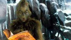 Toddler runs in terror after 'Grinch' surprises her during Christmas photo shoot