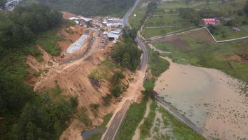 Guatemala digs through landslide where 100 believed buried