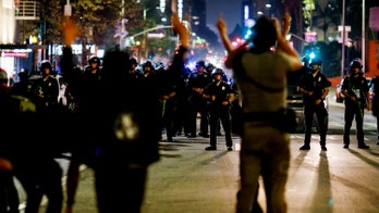 Los Angeles police accused of targeting 2 videographers during overnight unrest, report says