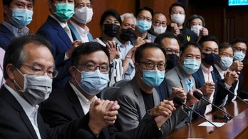 Hong Kong's pro-democracy lawmakers to resign after 4 legislators disqualified for 'endangering security'