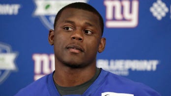 Ex-Giant Baker cleared of robbery; victims' lawyer arrested