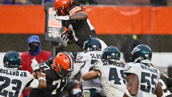 Browns survive without Garrett, down Eagles in steady rain