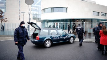 Berlin police: Car with with slogan on side hits chancellery gate