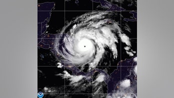 Hurricane Iota set for landfall, winter storms unsettle the West