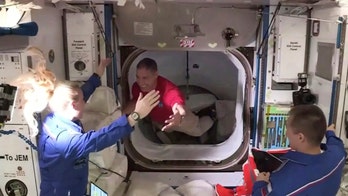 NASA astronauts become latest space station residents in historic SpaceX Crew Dragon mission