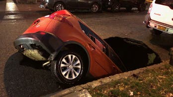 New York City sinkhole swallows SUV