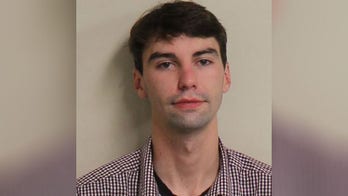 Pizzeria workers chase armed would-be thief 'around the restaurant' and restrain him until authorities arrive