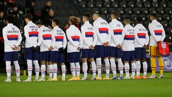 US men's soccer team wears social justice messages on warmup jackets before match vs. Wales