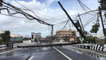 Powerful typhoon lashes Philippines, killing at least 10
