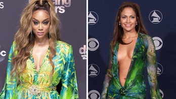 'DWTS' host Tyra Banks recreates Jennifer Lopez's iconic plunging Versace gown look from 2000 Grammys
