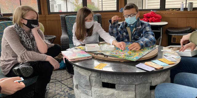 The CDC recommends precautions like wearing a mask and socially distancing at least six feet from people you don’t live with. (The Ohio State University Wexner Medical Center)