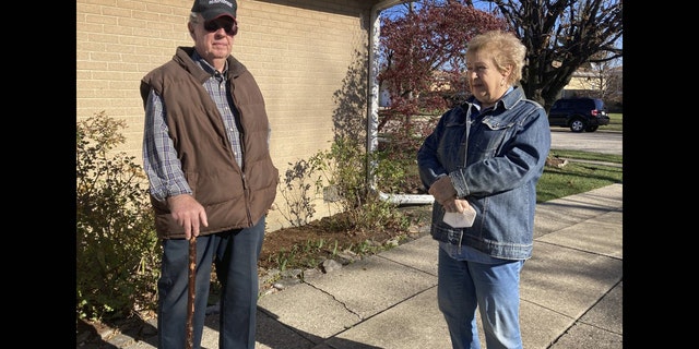<br>
Dan and Barbara Donovan of Niles say they were targeted by intruders when a man claiming to be a ComEd employee came to their home, Tuesday, Nov. 17, 2020 in Niles, Ill. Donovan, an 81-year-old former Marine from suburban Chicago used his grandfather's antique Irish walking stick to chase off three burglars and deliver one a thump in the head for his trouble.(Jennifer Johnson/Chicago Tribune via AP)