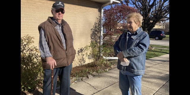 <br> Dan and Barbara Donovan of Niles say they were targeted by intruders when a man claiming to be a ComEd employee came to their home, Tuesday, Nov. 17, 2020 in Niles, Ill. Donovan, an 81-year-old former Marine from suburban Chicago used his grandfather's antique Irish walking stick to chase off three burglars and deliver one a thump in the head for his trouble.(Jennifer Johnson/Chicago Tribune via AP)