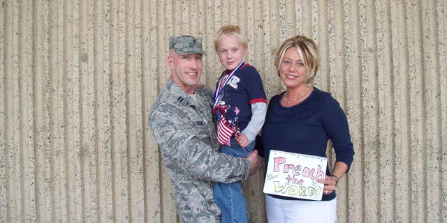 Former U.S. military chaplain, Curt Cizek with his wife and son before an Iraq deployment
