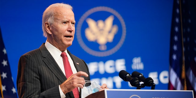 President-elect Joe Biden, accompanied by Vice President-elect Kamala Harris, speaks at The Queen theater, Thursday, Nov. 19, 2020, in Wilmington, Del. (AP Photo/Andrew Harnik)