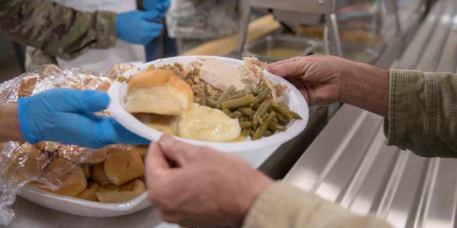 Airplanes, soldiers, veterans and their families gather for the Chaplains ’Thanksgiving Dinner on November 15, 2018 in Gowen Field, Boise, Idaho. The annual event is to provide free festive meals and build an esprit de corps among those who have already served and are serving. (Photo by the U.S. Air Guard Sergeant Joshua C. Allmaras)