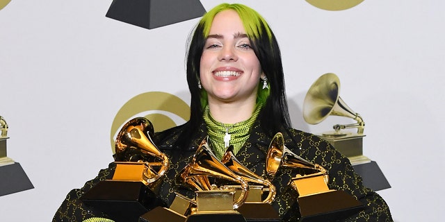 Billie Eilish celebrates her six Grammy Awards at the 2020 Grammy Awards. 